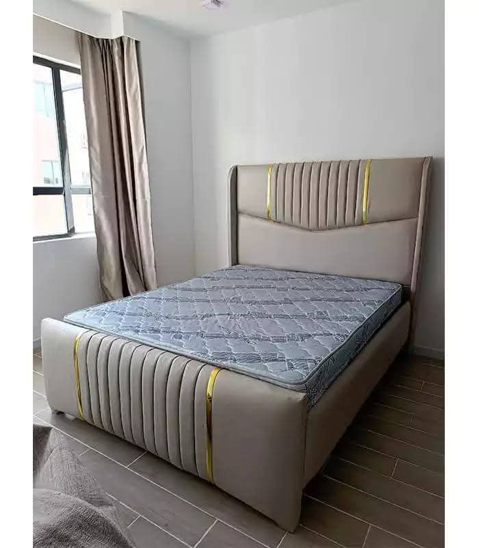 Aurelia Gold-Line Wingback Bed